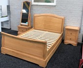 Oak sleigh bed with drawers