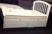 White solid wood bed with storage drawers