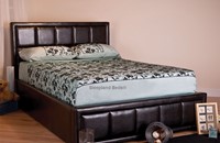 Black faux leather king size ottoman bed