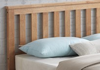Close view of the solid wooden bedstead