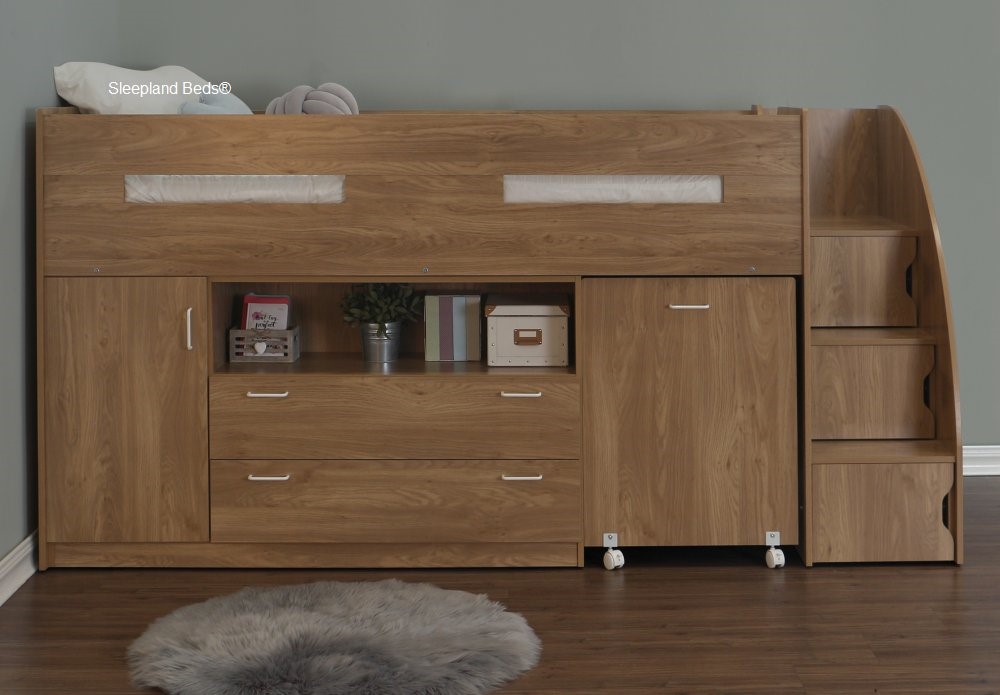 Oak childrens midsleepers with desk and storage underneath, with staircase stair cupboards at the foot end of the bed